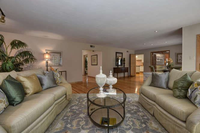 18531 Decatur Road Los Gatos, CA 95030 - Photo 11 of 23 a living room with furniture a rug and a chandelier