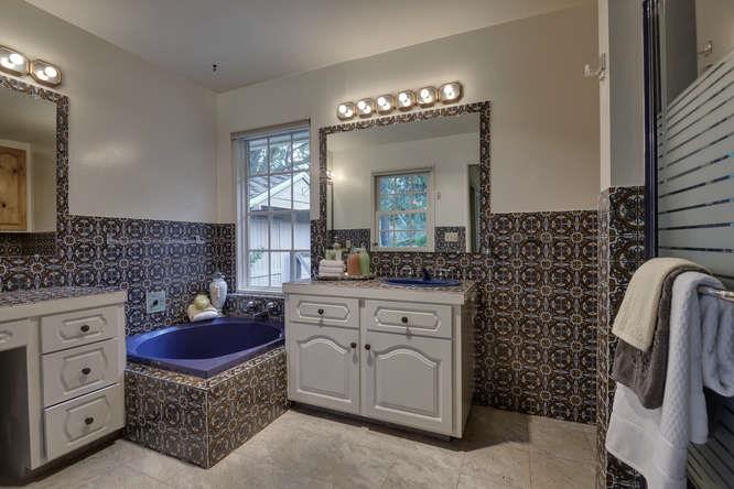 18531 Decatur Road Los Gatos, CA 95030 - Photo 14 of 23 a spacious bathroom with a double vanity sink and a mirror