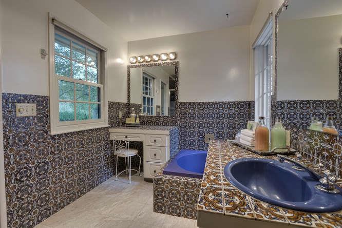 18531 Decatur Road Los Gatos, CA 95030 - Photo 15 of 23 a bathroom with a sink a toilet and a large mirror