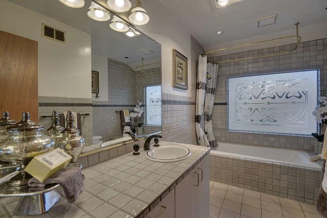18531 Decatur Road Los Gatos, CA 95030 - Photo 19 of 23 a bathroom with a tub sink and mirror