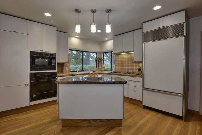 18531 Decatur Road Los Gatos, CA 95030 - Photo 6 of 23 a kitchen with granite countertop a refrigerator and a stove top oven