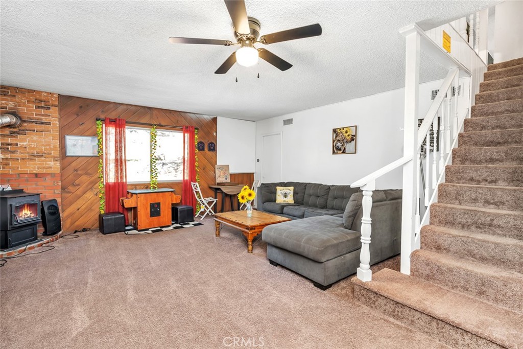 245 Mountain Shadow Road Wofford Heights, CA 93285 - Photo 18 of 72 a living room with furniture and a large window