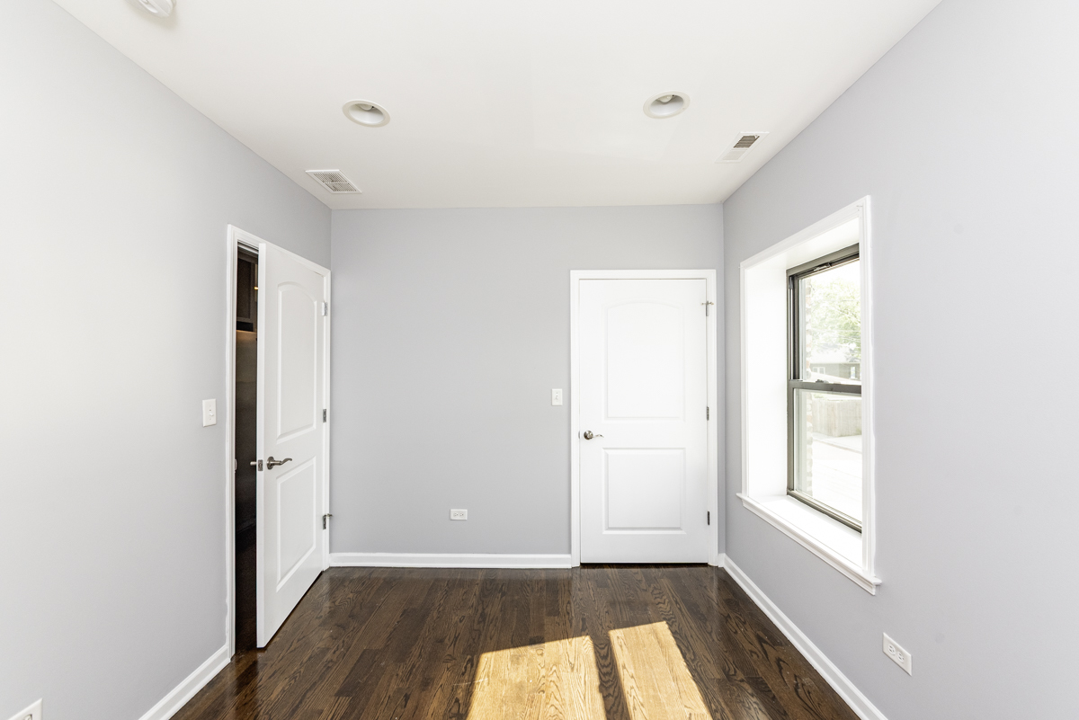 1012 South 1st Avenue, Unit 103 Maywood, IL 60153 - Photo 9 of 13 a view of a room with wooden floor and window in a room