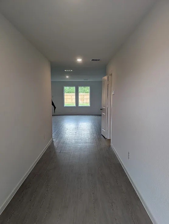 9015 Rose Pelican Lane Baytown, TX 77521 - Photo 14 of 14 an empty room with wooden floor and windows