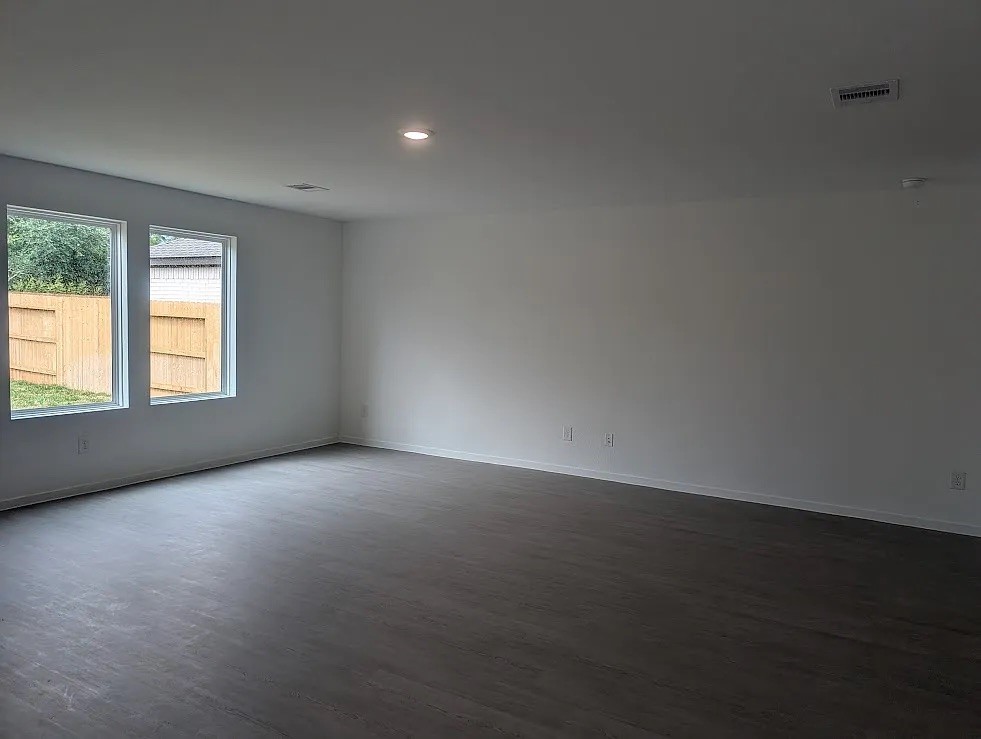 9015 Rose Pelican Lane Baytown, TX 77521 - Photo 9 of 14 an empty room with a window