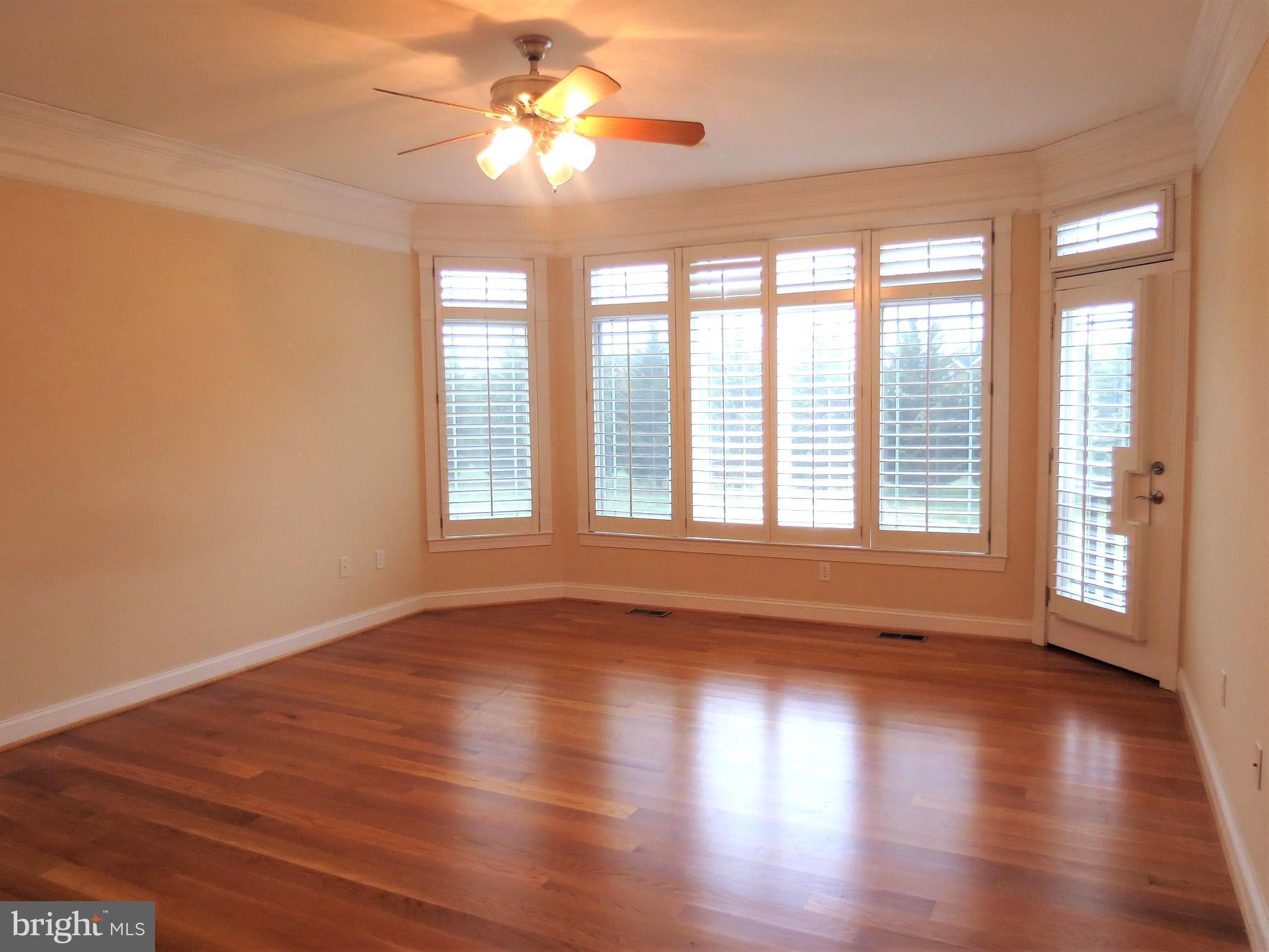 6170 Scaggs Road Owings, MD 20736 - Photo 16 of 30 a view of an empty room with wooden floor and a window
