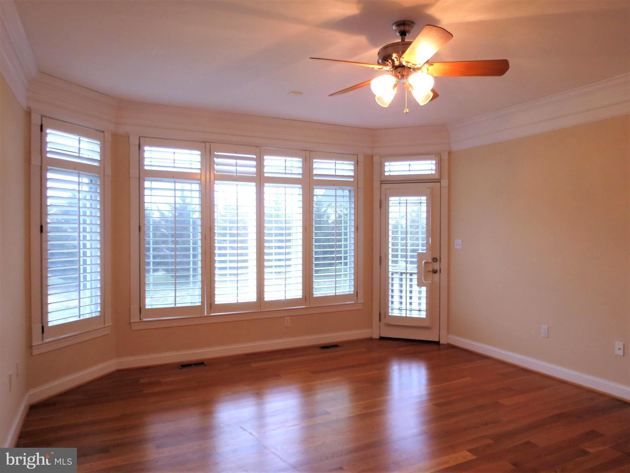 6170 Scaggs Road Owings, MD 20736 - Photo 17 of 30 a view of an empty room with window and wooden floor