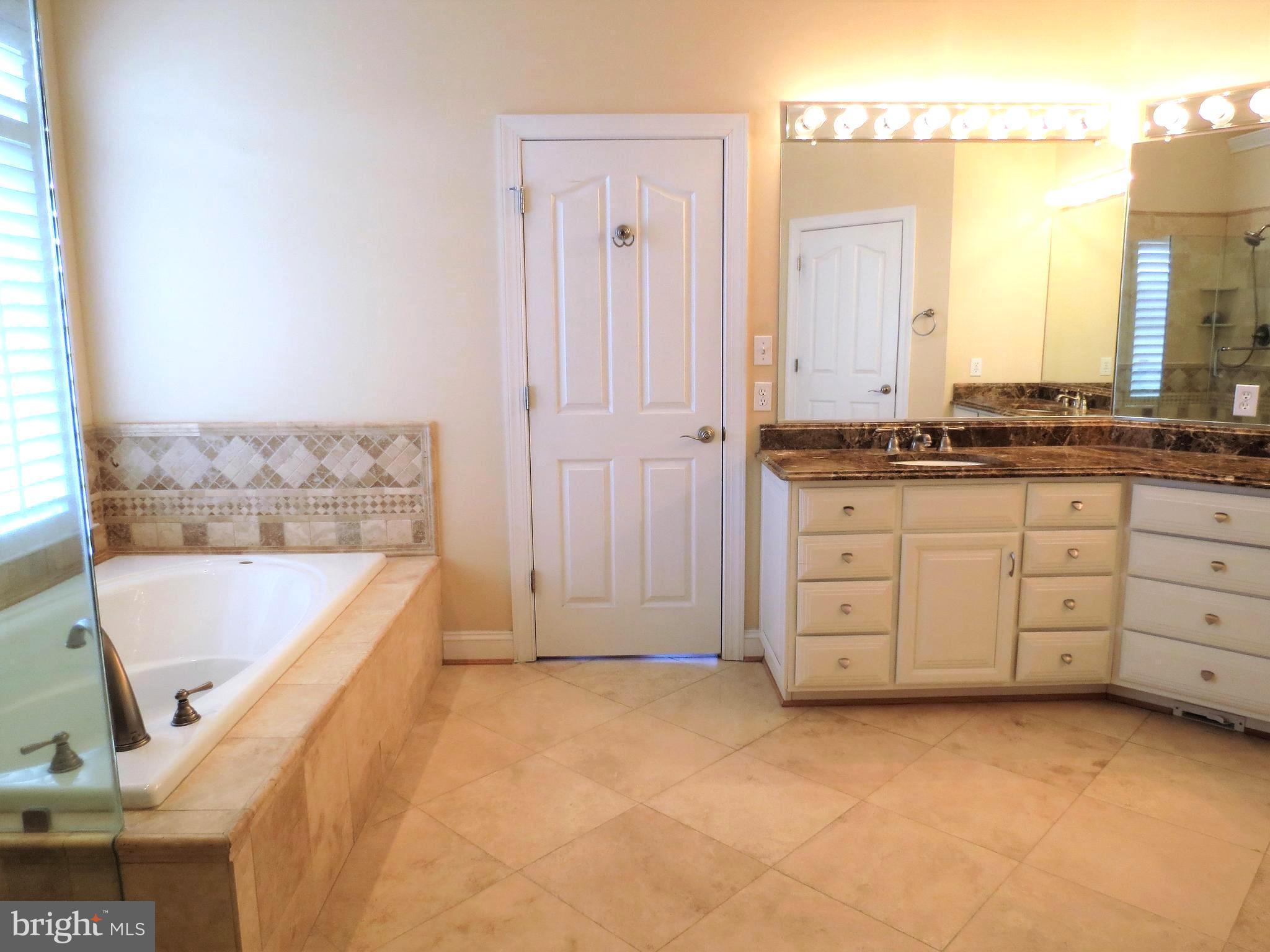 6170 Scaggs Road Owings, MD 20736 - Photo 18 of 30 a view of a kitchen with tub and windows