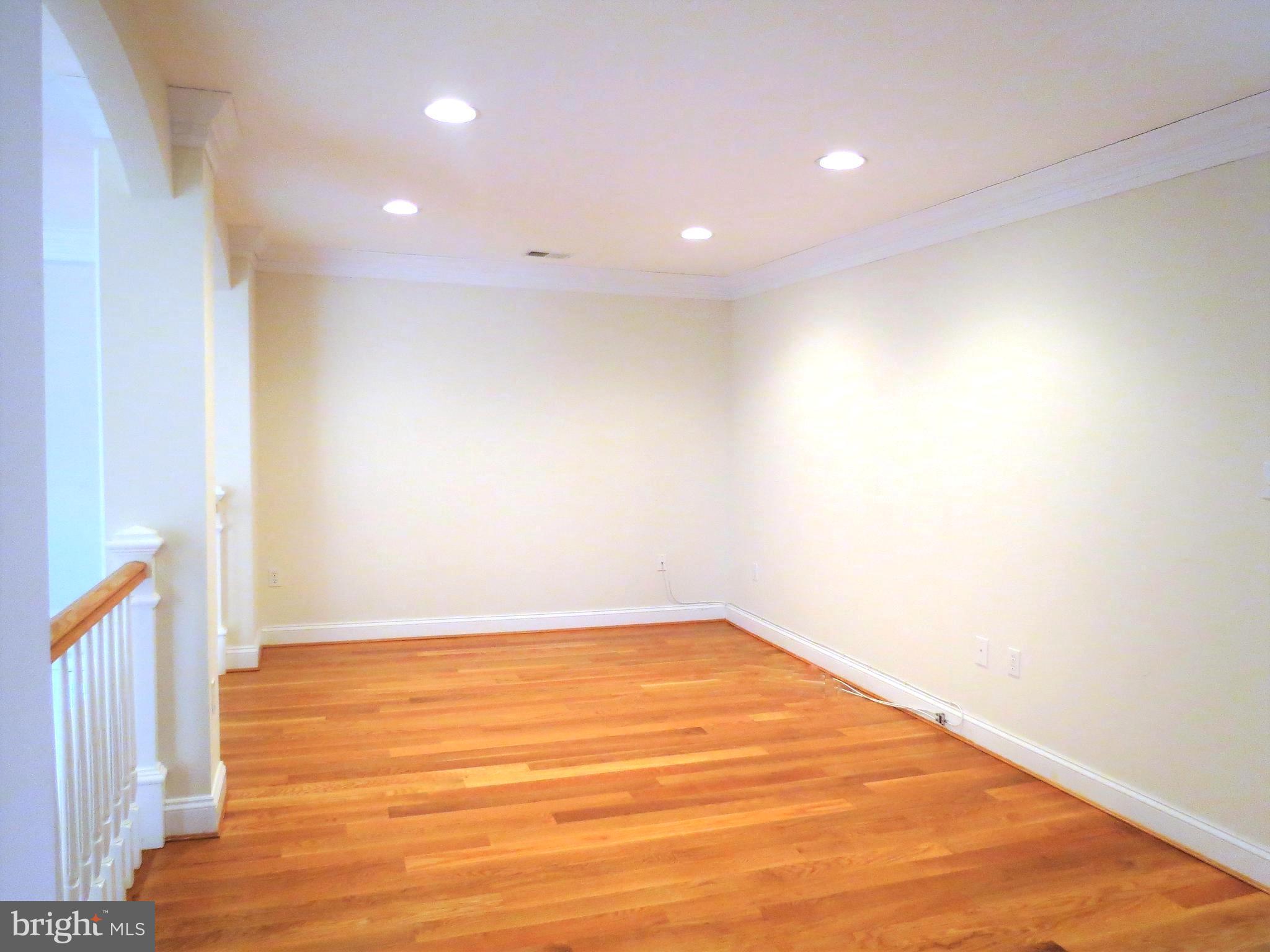 6170 Scaggs Road Owings, MD 20736 - Photo 22 of 30 a view of an empty room with wooden floor