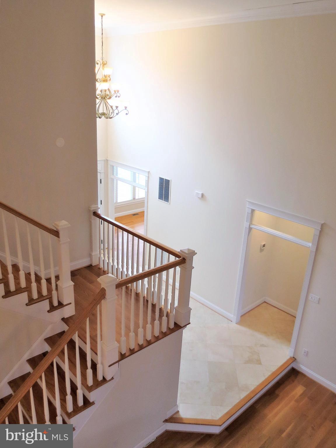 6170 Scaggs Road Owings, MD 20736 - Photo 23 of 30 a view of staircase with railing and white walls