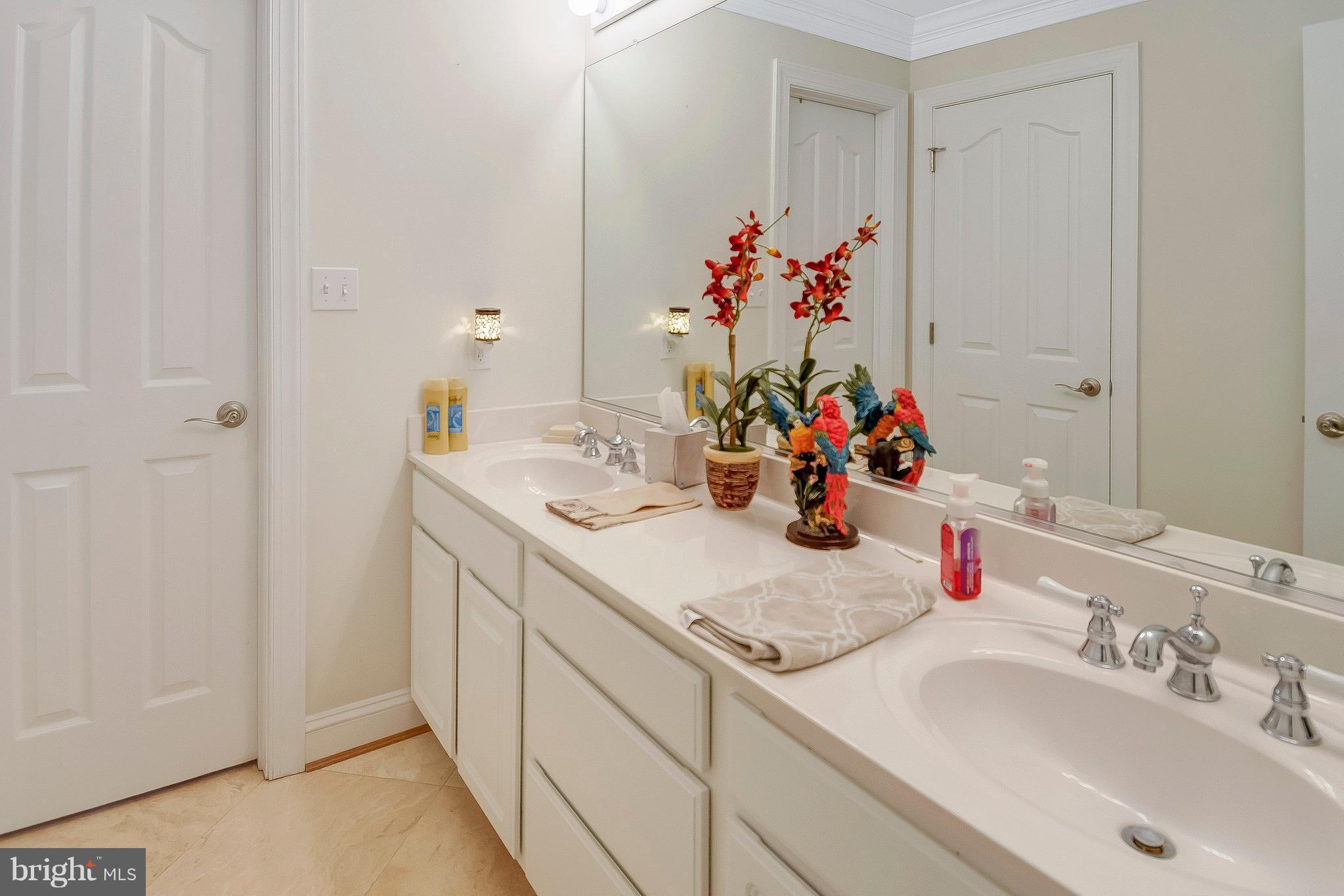 6170 Scaggs Road Owings, MD 20736 - Photo 24 of 30 a bathroom with a sink vanity and a mirror