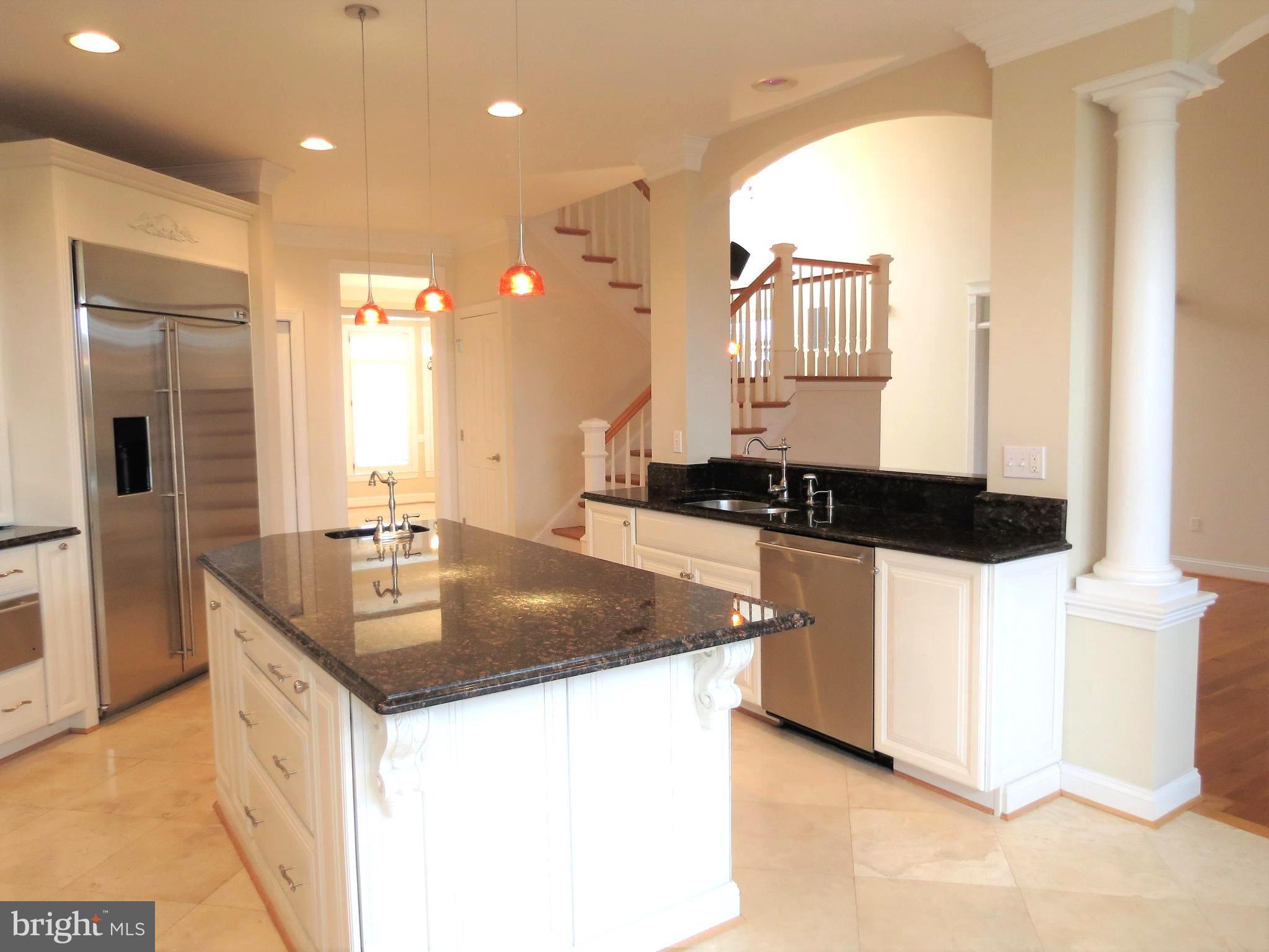 6170 Scaggs Road Owings, MD 20736 - Photo 8 of 30 a kitchen with stainless steel appliances granite countertop a sink and a refrigerator