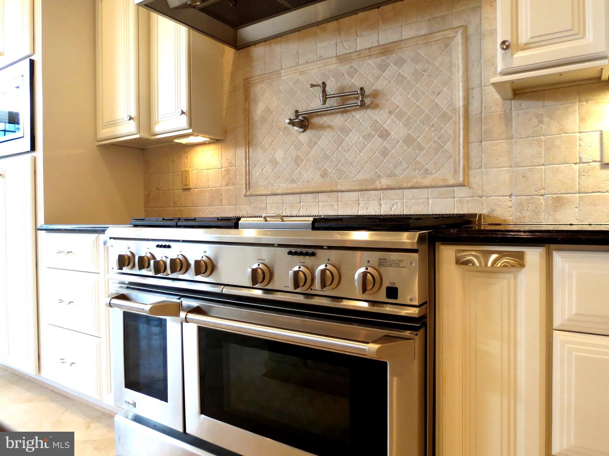 6170 Scaggs Road Owings, MD 20736 - Photo 9 of 30 a close view of a stove top oven sitting inside of a kitchen