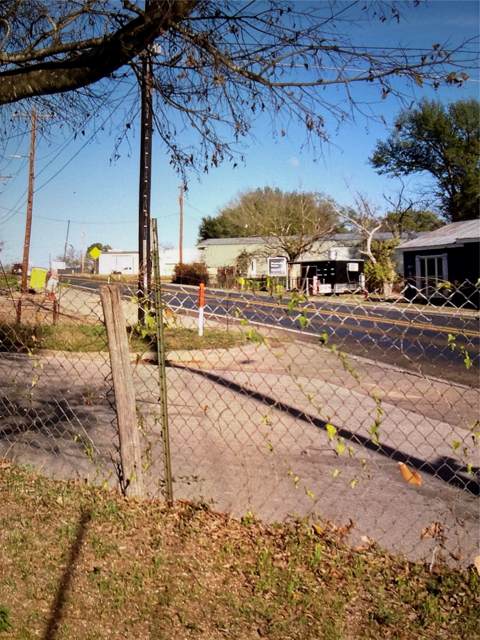 605 Independence Street Brenham, TX 77833 - Photo 2 of 3 a view of a street with houses