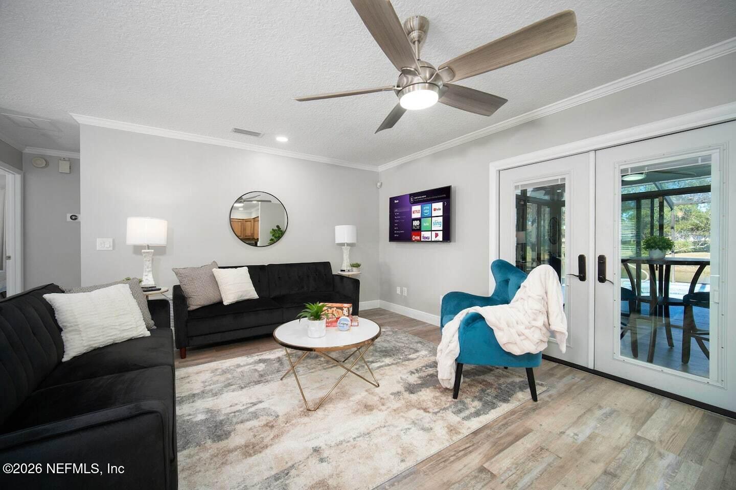 11613 Lake Ride Drive Jacksonville, FL 32223 - Photo 15 of 42 a living room with furniture and a table