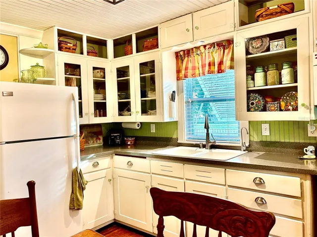 a kitchen that has a cabinets and a stove