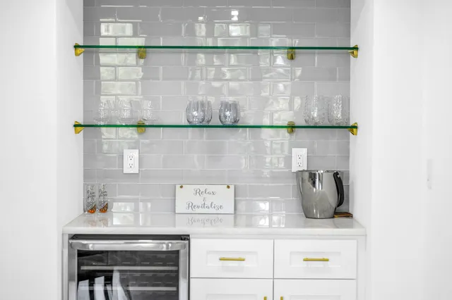 a kitchen with stainless steel appliances a refrigerator and cabinets