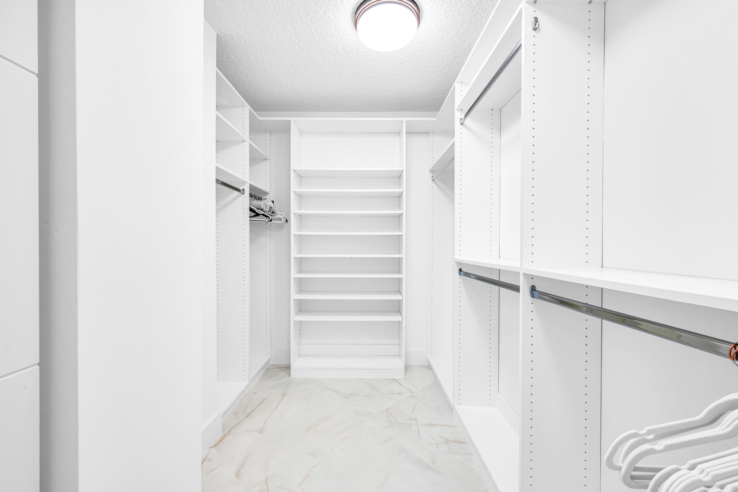 100 Southeast 5th Avenue, Unit 304 Boca Raton, FL 33432 - Photo 16 of 62 a view of closet area with empty racks