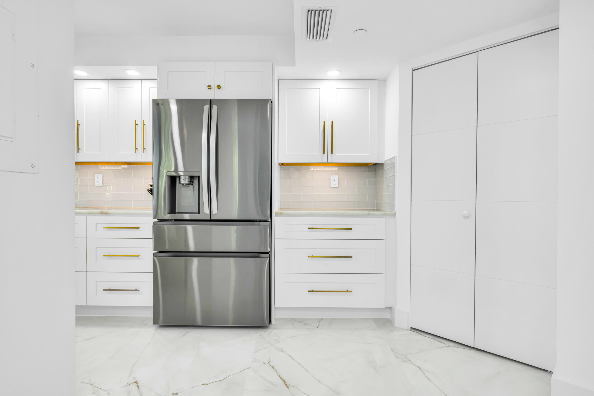 100 Southeast 5th Avenue, Unit 304 Boca Raton, FL 33432 - Photo 17 of 62 a kitchen with stainless steel appliances a refrigerator and cabinets