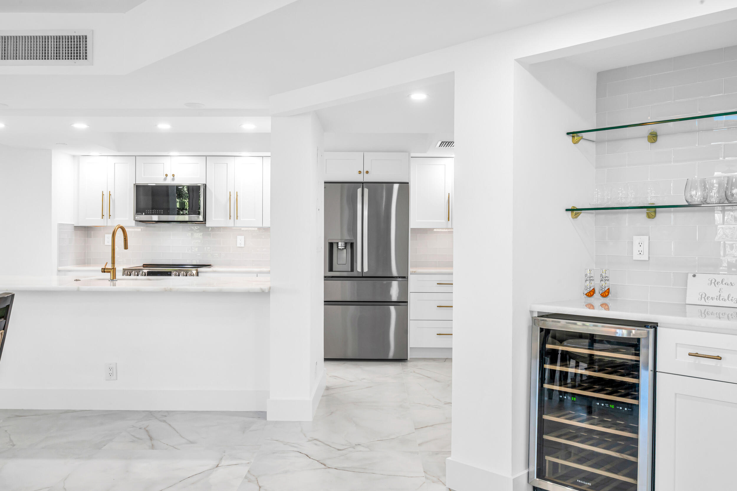 100 Southeast 5th Avenue, Unit 304 Boca Raton, FL 33432 - Photo 3 of 62 a kitchen with a refrigerator and a sink