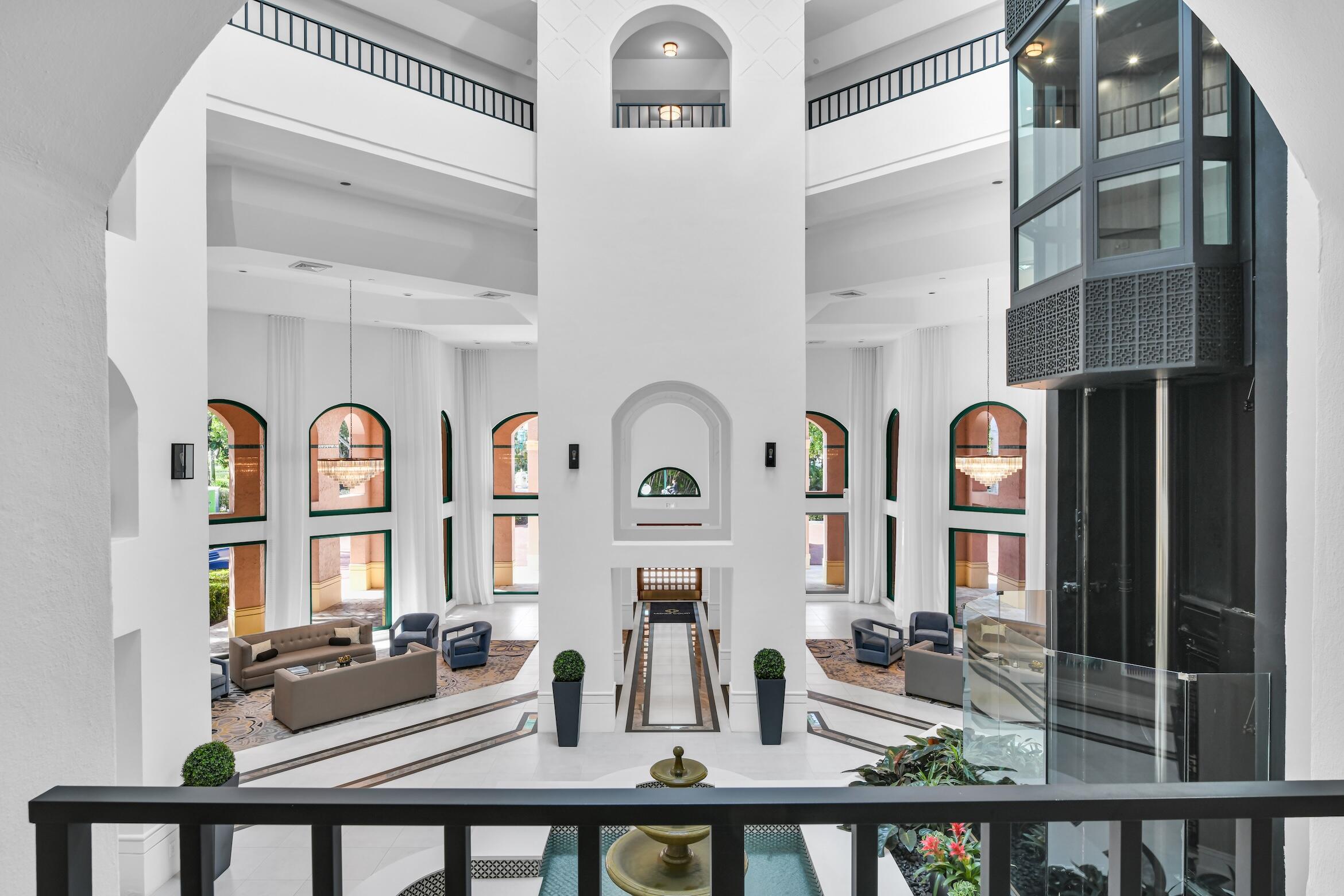 100 Southeast 5th Avenue, Unit 304 Boca Raton, FL 33432 - Photo 32 of 62 a front view of a house with outdoor seating