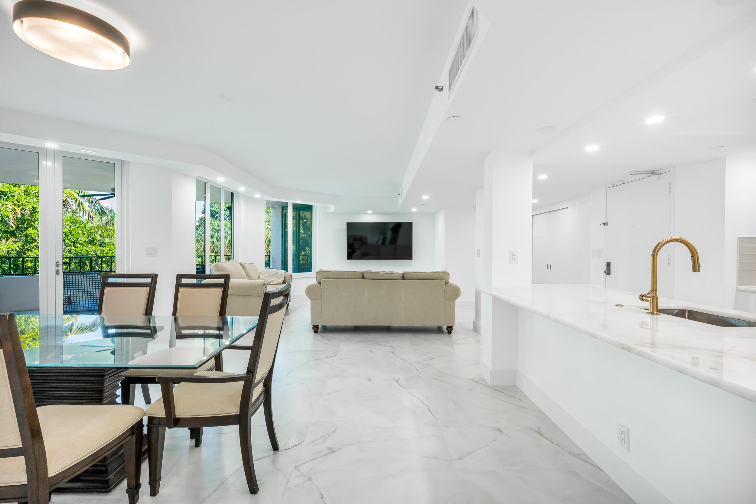 100 Southeast 5th Avenue, Unit 304 Boca Raton, FL 33432 - Photo 9 of 62 a view of a dining room with furniture and window