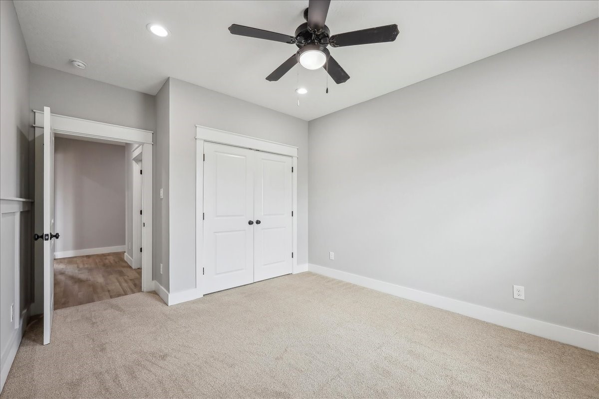 7722 Pond Circle Beaumont, TX 77707 - Photo 20 of 34 an empty room with chandelier fan