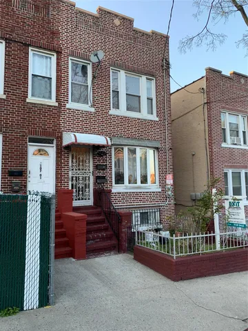 a front view of a house with barbeque area