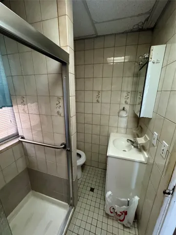 a bathroom with a sink and toilet