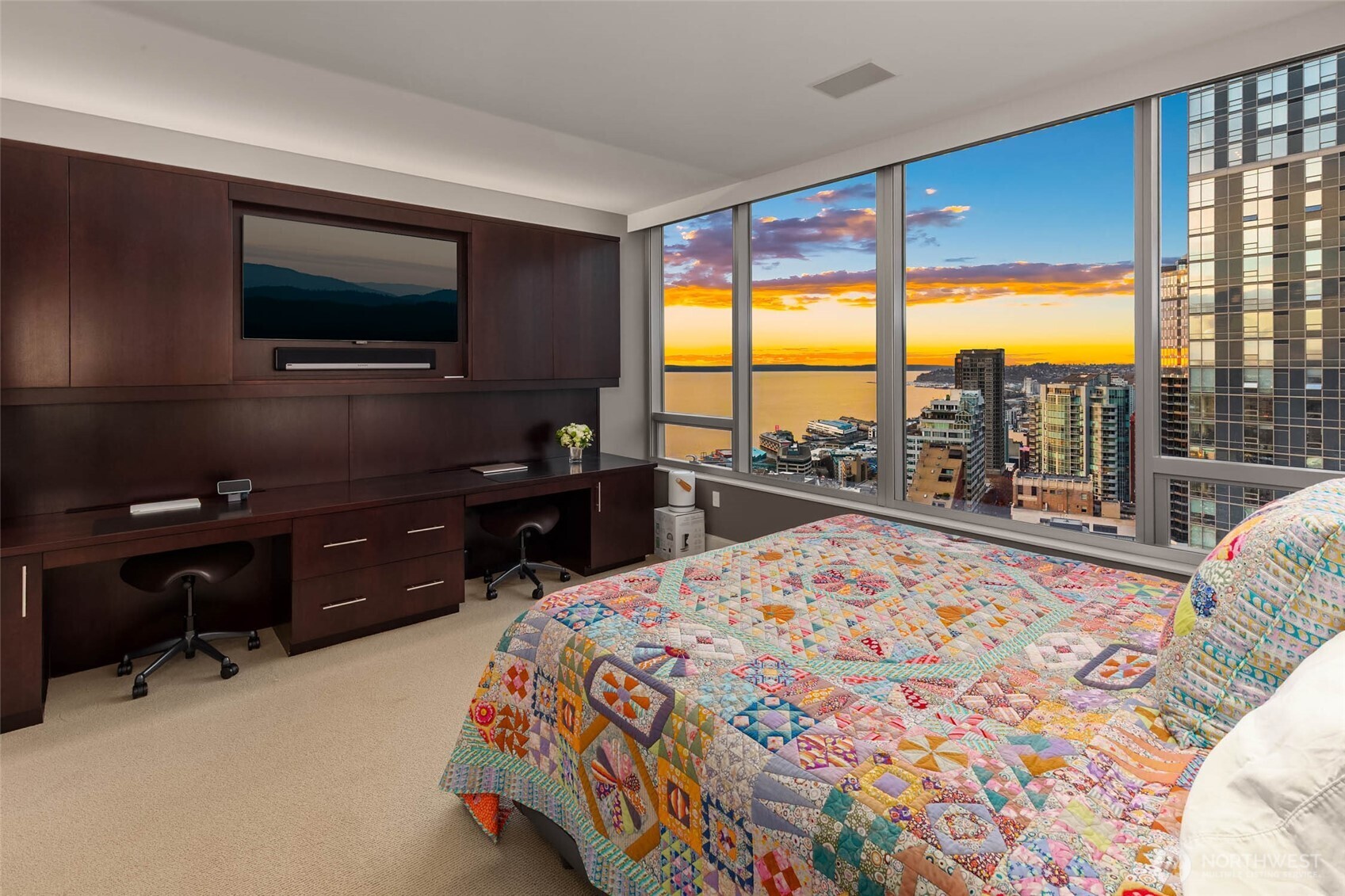 1521 2nd Avenue, Unit 2800 Seattle, WA 98101 - Photo 21 of 35 a bed sitting in a bedroom next to a window