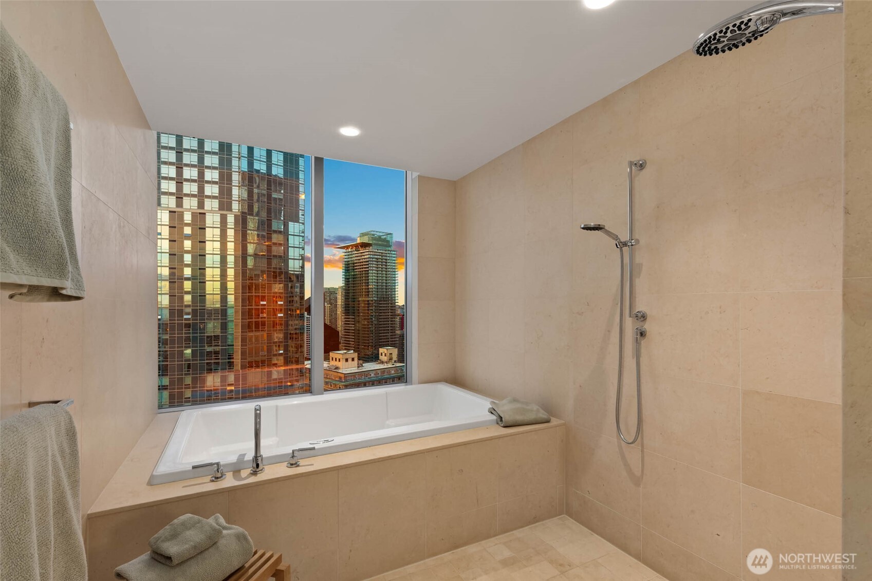 1521 2nd Avenue, Unit 2800 Seattle, WA 98101 - Photo 23 of 35 a bathroom with a tub and a shower