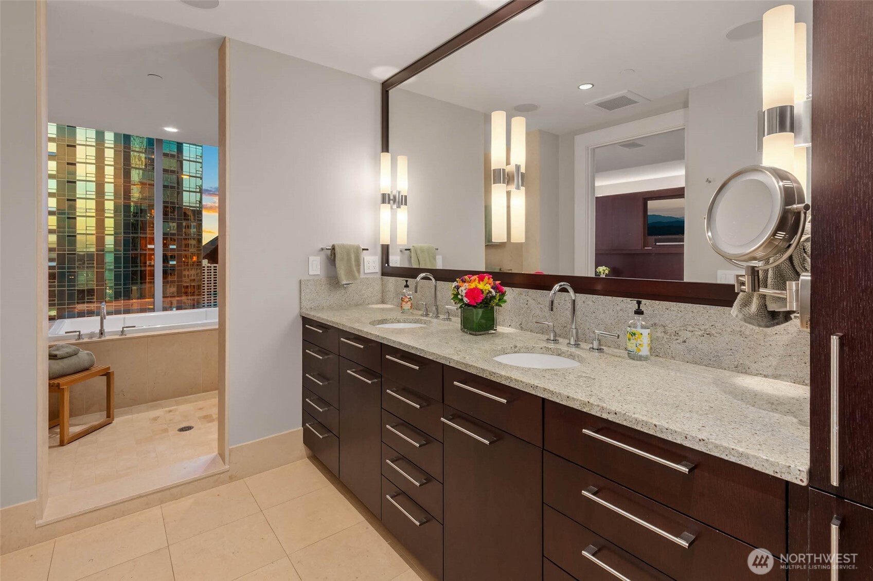1521 2nd Avenue, Unit 2800 Seattle, WA 98101 - Photo 24 of 35 a bathroom with a granite countertop double vanity sink and a mirror