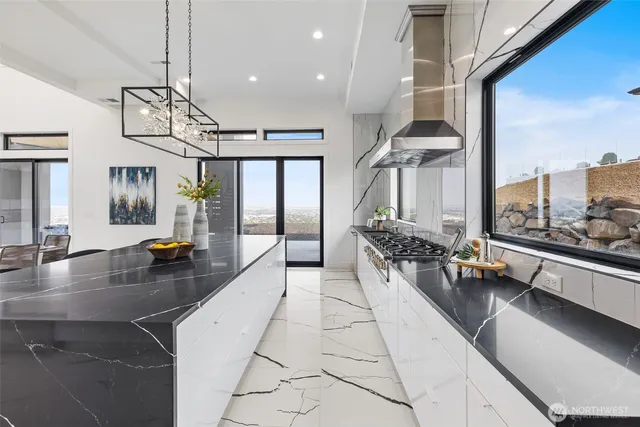 a lobby with furniture and floor to ceiling window