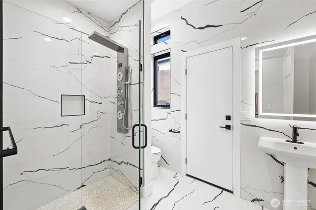 a bathroom with a sink and shower