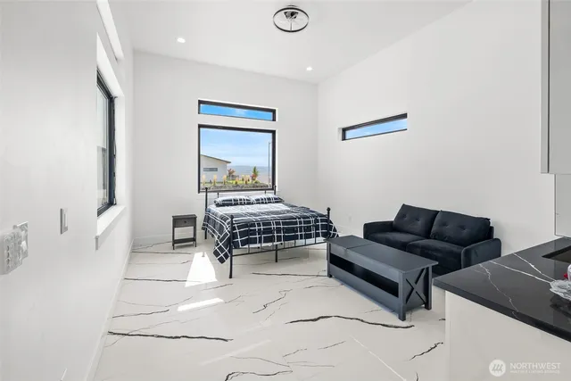a living room with furniture and a piano