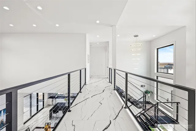 a view of an entryway with wooden floor