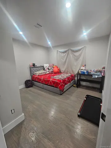 a bedroom with furniture and a chandelier