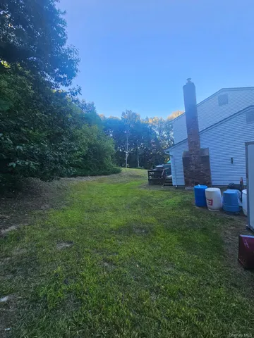 a view of a garden with a house