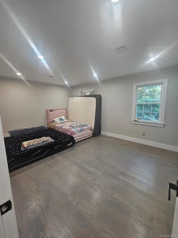 a view of a room with gym equipment and a window