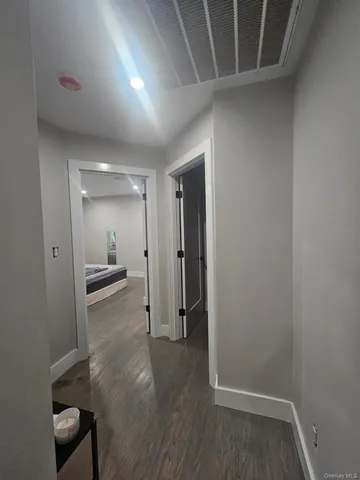 a view of entryway with wooden floor