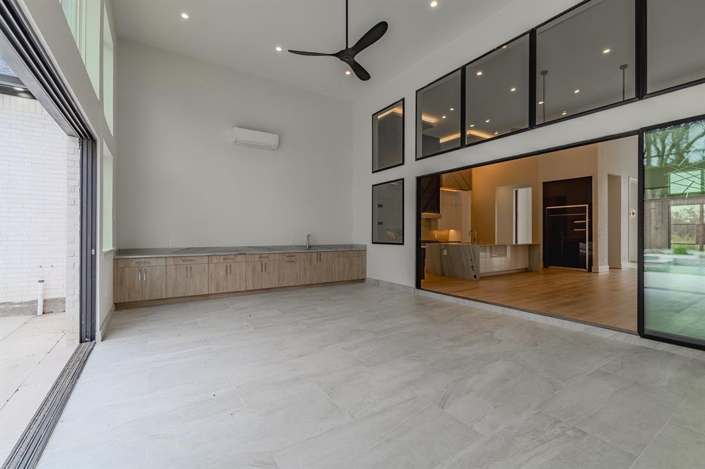11314 Hillcrest Road Dallas, TX 75230 - Photo 13 of 40 a view of an empty room with cabinet and mirrors
