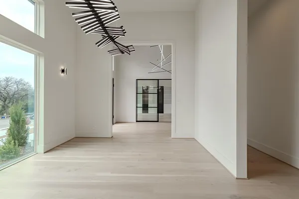 an empty room with windows and closet