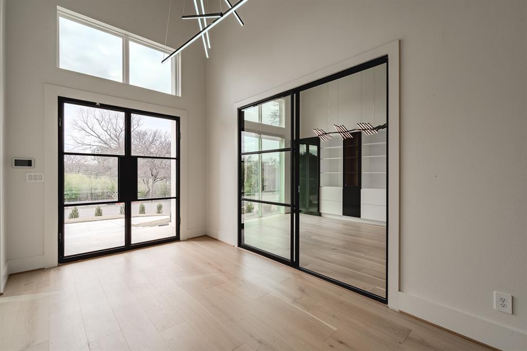 11314 Hillcrest Road Dallas, TX 75230 - Photo 5 of 40 a view of a room with sliding glass door