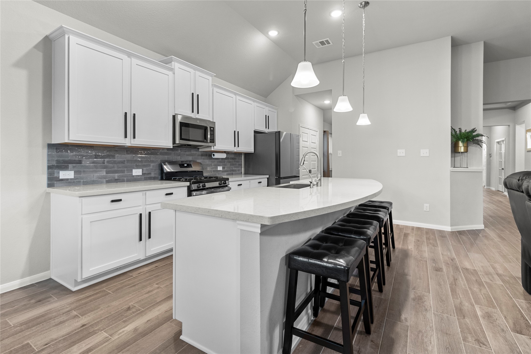 2811 Bisbee Road League City, TX 77573 - Photo 1 of 28 a kitchen with a sink stainless steel appliances and white cabinets