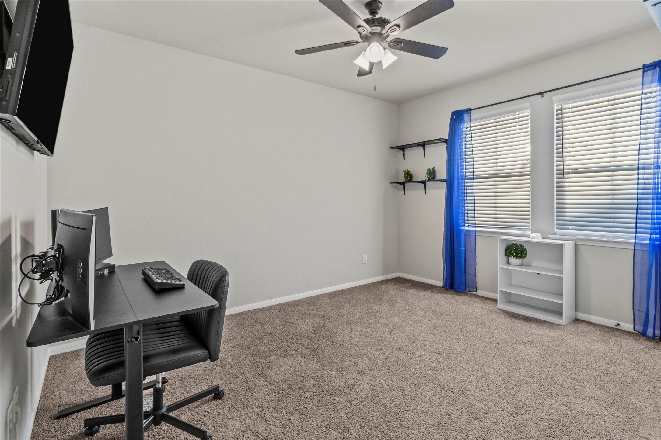 2811 Bisbee Road League City, TX 77573 - Photo 17 of 28 a view of a workspace with furniture and a window