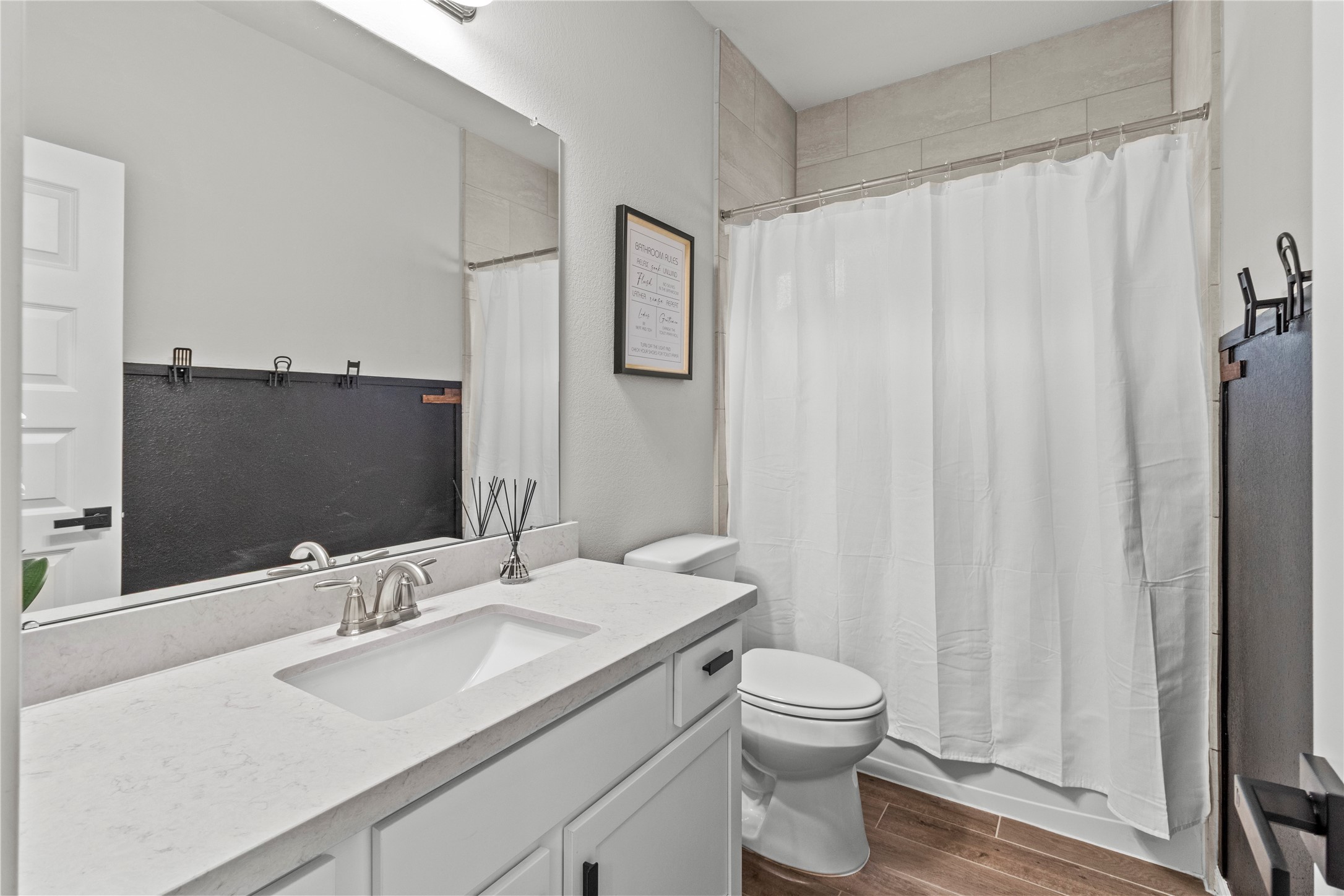 2811 Bisbee Road League City, TX 77573 - Photo 19 of 28 a bathroom with a granite countertop sink toilet and shower