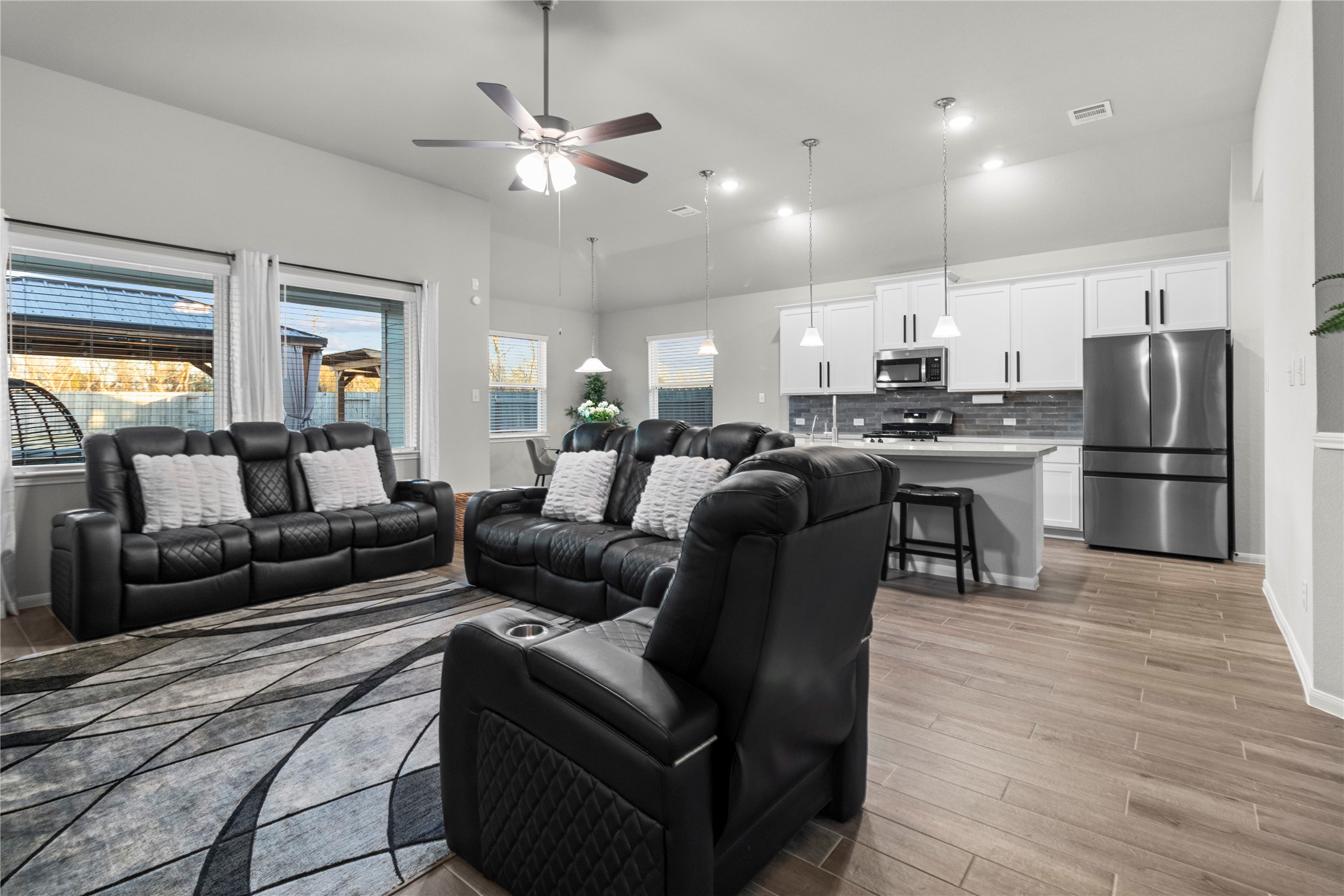 2811 Bisbee Road League City, TX 77573 - Photo 3 of 28 a view of kitchen with refrigerator stove and wooden floor