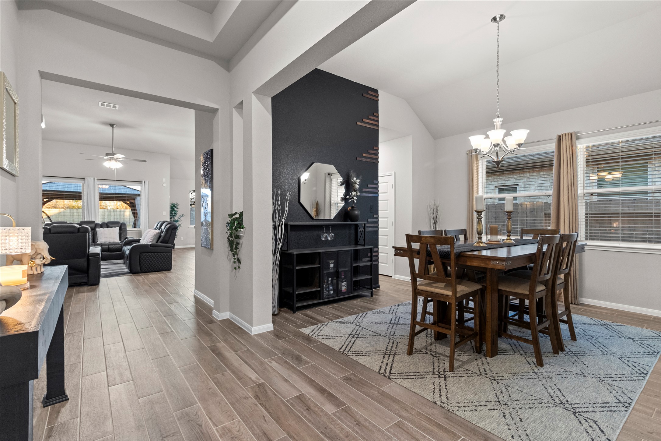 2811 Bisbee Road League City, TX 77573 - Photo 5 of 28 a view of a dining room with furniture and chandelier