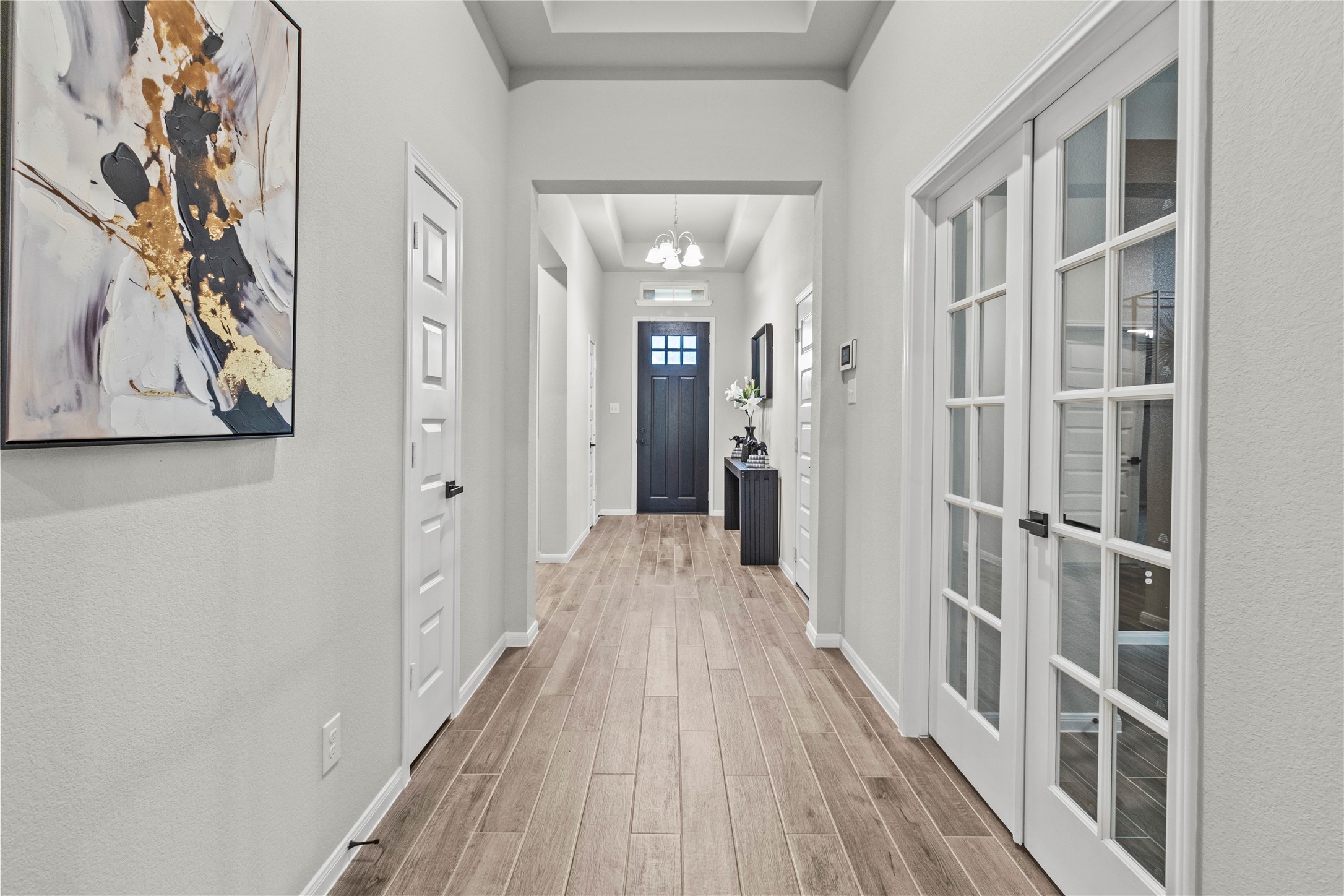 2811 Bisbee Road League City, TX 77573 - Photo 7 of 28 a view of a hallway with wooden floor and a bathroom