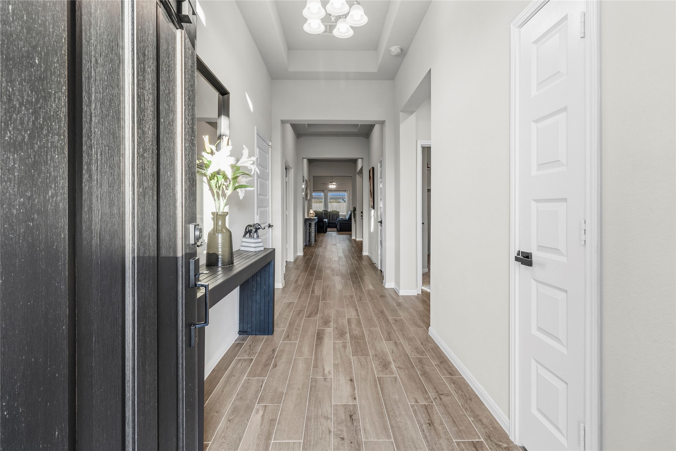 2811 Bisbee Road League City, TX 77573 - Photo 8 of 28 a view of a hallway view with wooden floor and furniture